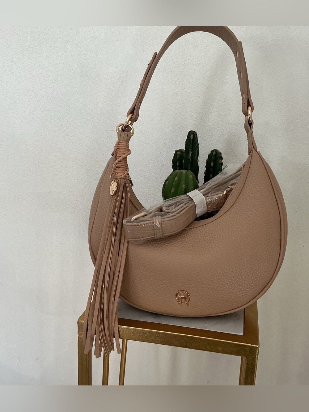 House of Harlow brown crescent hobo bag with tassel detail